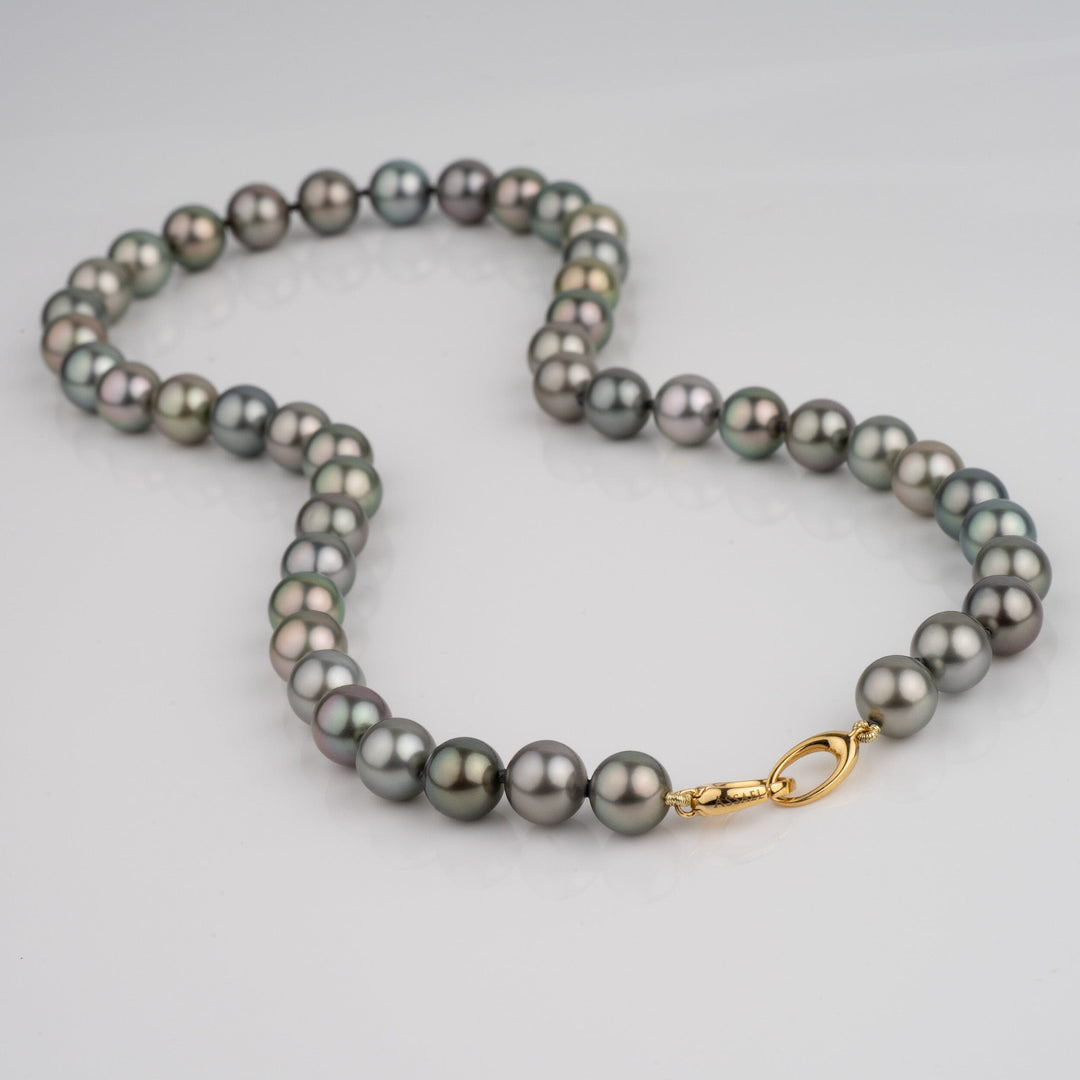 Gem grade Tahitian necklace with medium dark green bodycolor and pistachio, blue, and aubergine overtones. Round 8.0–9.3 mm pearls, natural color, finished with an 18k yellow gold clasp.
