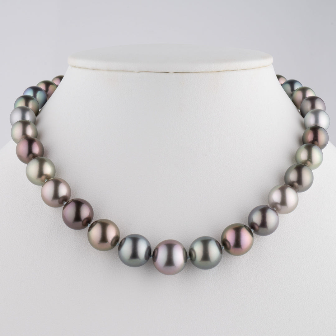 Museum-level multicolor Tahitian pearl necklace, 33 round pearls 10.1–14.2 mm on bust.