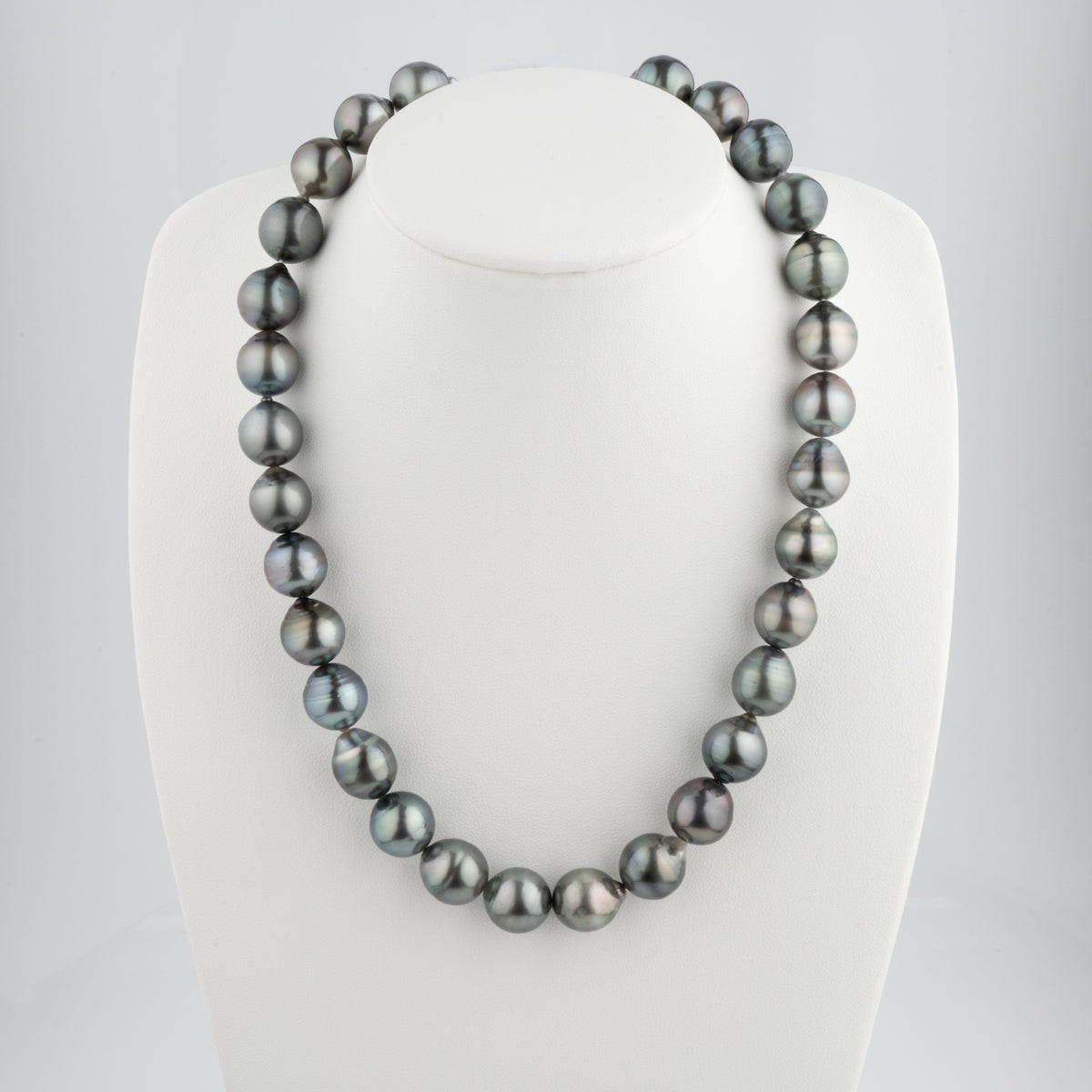 12.1-12.7 mm AA+ Baroque Tahitian Pearl Necklace displayed on a white bust, featuring lustrous, naturally irregular black and gray pearls with subtle overtones.
