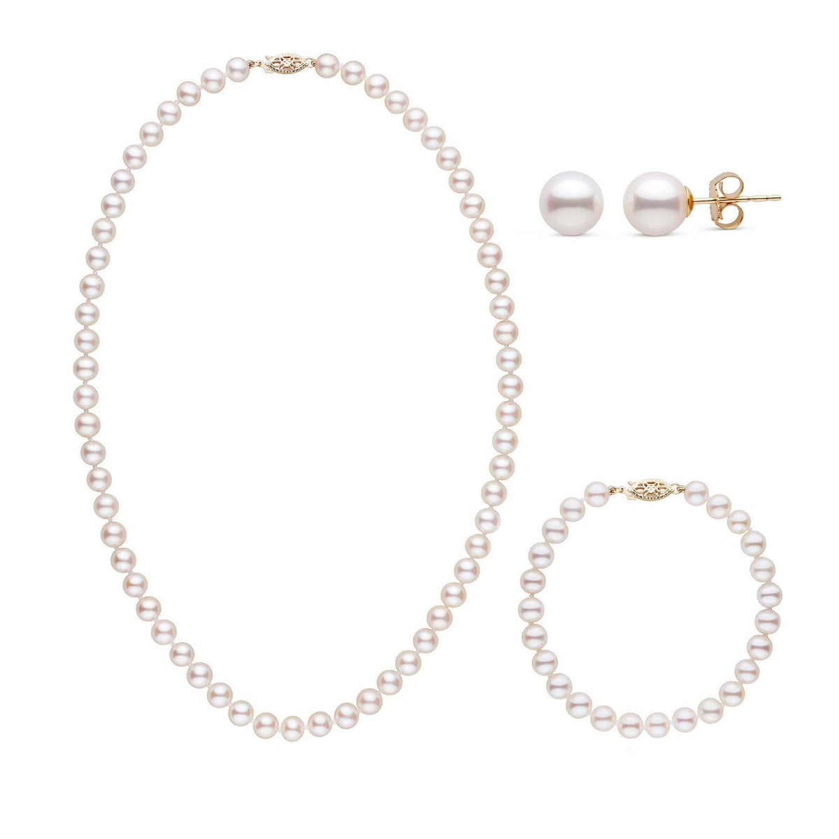 A three-piece set of white freshwater pearls including a necklace, a bracelet, and a pair of stud earrings, set in 14k yellow gold all displayed on a white background.