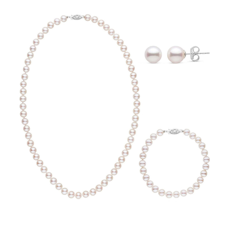 A three-piece set of white freshwater pearls including a necklace, a bracelet, and a pair of stud earrings, all displayed on a white background.