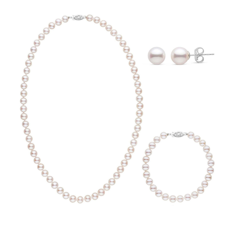 A three-piece set of white freshwater pearls including a necklace, a bracelet, and a pair of stud earrings, all displayed on a white background.