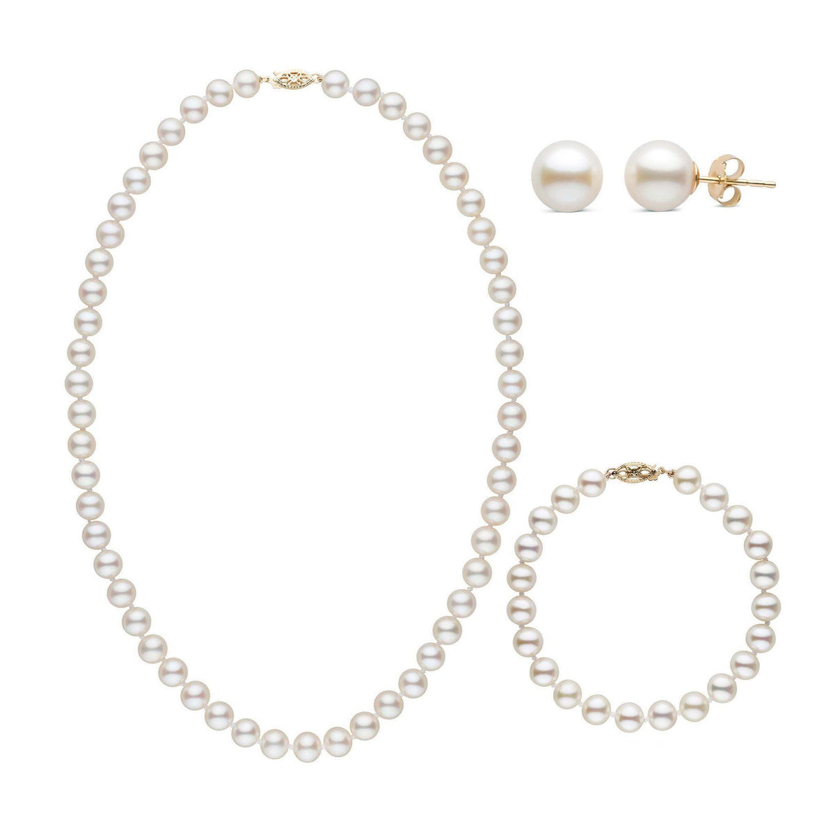 A three-piece set of white freshwater pearls including a necklace, a bracelet, and a pair of stud earrings, with each piece knotted and clasped in yellow gold.
