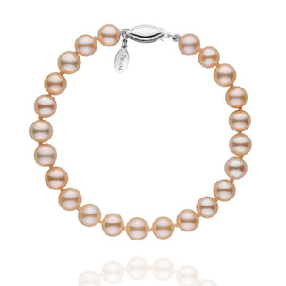 A bracelet composed of pink to peach pastel-colored freshwater pearls with a gold clasp.