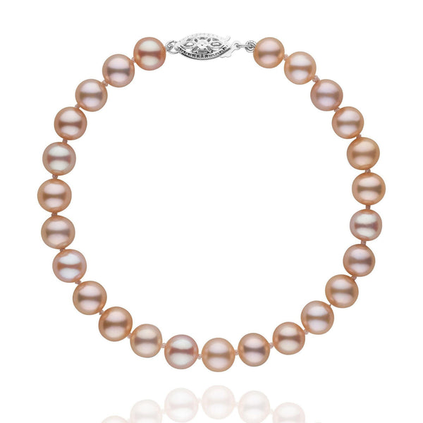 6.5-7.0 mm AAA Pink to Peach Freshwater Pearl Bracelet featuring round cultured pearls with warm pink and peach hues and a 14K white gold clasp, elegant and timeless design.