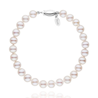 6.0-7.0 mm White Freshadama Pearl Bracelet featuring round, lustrous white freshwater pearls with a 14K white gold clasp, showcasing a classic and elegant pearl bracelet design.