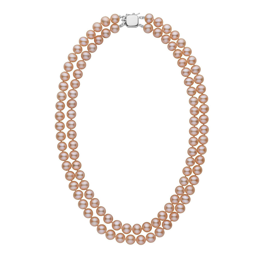 A double strand of round pink to peach freshwater pearls with a white gold clasp.