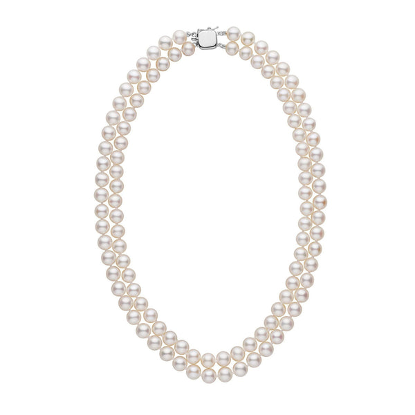 A double strand of white freshwater pearls with a gold clasp, displayed against a white background.
