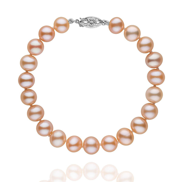 7.5-8.0 mm Pink to Peach Freshwater AA+ Pearl Bracelet featuring luminous round pearls with a subtle pink to peach gradient and a decorative 14K white gold clasp.