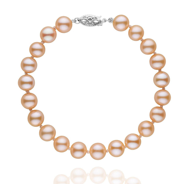 7.5-8.0 mm AAA Pink to Peach Freshwater Pearl Bracelet featuring lustrous pink to peach freshwater pearls with a decorative 14K white gold clasp, elegant and timeless pearl bracelet.