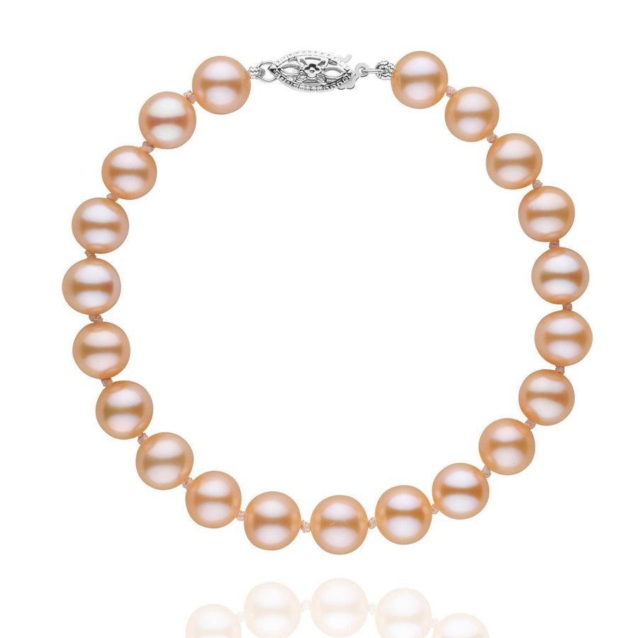 7.5-8.0 mm AAA Pink to Peach Freshwater Pearl Bracelet featuring lustrous pink to peach freshwater pearls with a decorative 14K white gold clasp, elegant and timeless pearl bracelet.