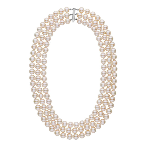 A triple-strand necklace of white freshwater cultured pearls with a gold clasp.