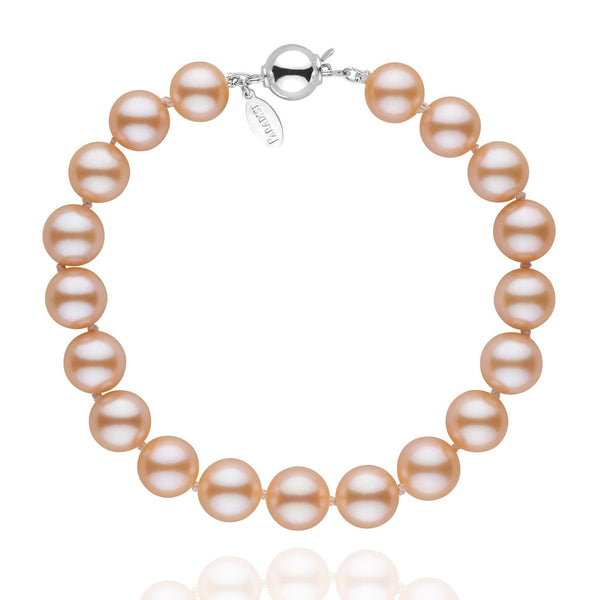 Close-up of the 8.5-9.0 mm Pink to Peach Freshadama Pearl Bracelet featuring lustrous round pearls with a subtle gradient from pink to peach and a polished 14K white gold clasp.