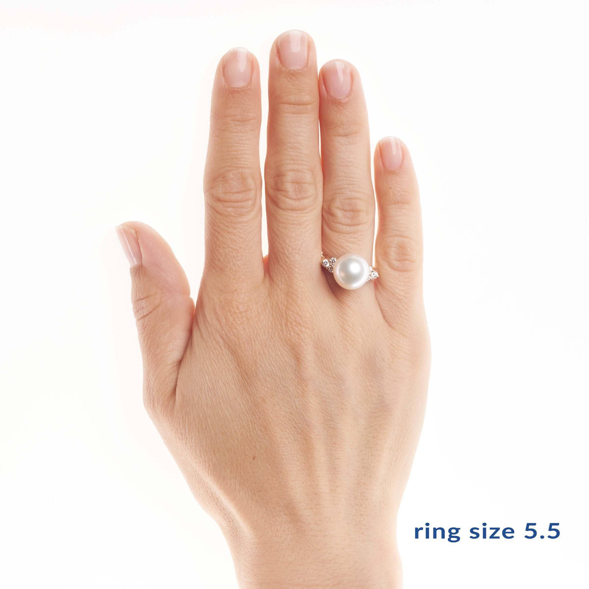 Hand displaying the Always Collection 11.0-12.0 mm White South Sea Pearl Ring featuring a large white pearl set on a 14K white gold band with small accent stones.