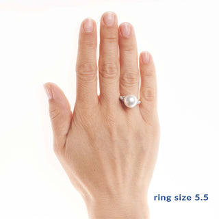 Hand displaying the Always Collection 11.0-12.0 mm White South Sea Pearl Ring featuring a large white pearl set on a 14K white gold band with small accent stones.