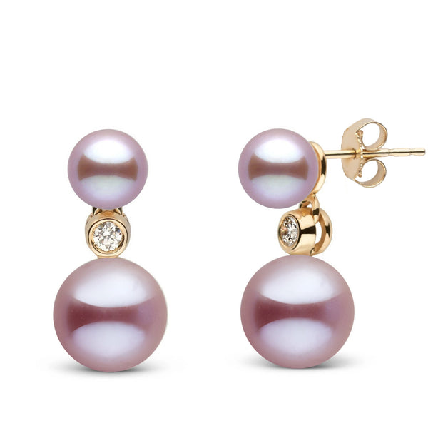 6.5-9.0 mm Lavender Freshadama Pearl and Diamond Duet Dangle Earrings featuring round lavender freshwater pearls accented with small sparkling diamonds set in yellow gold.
