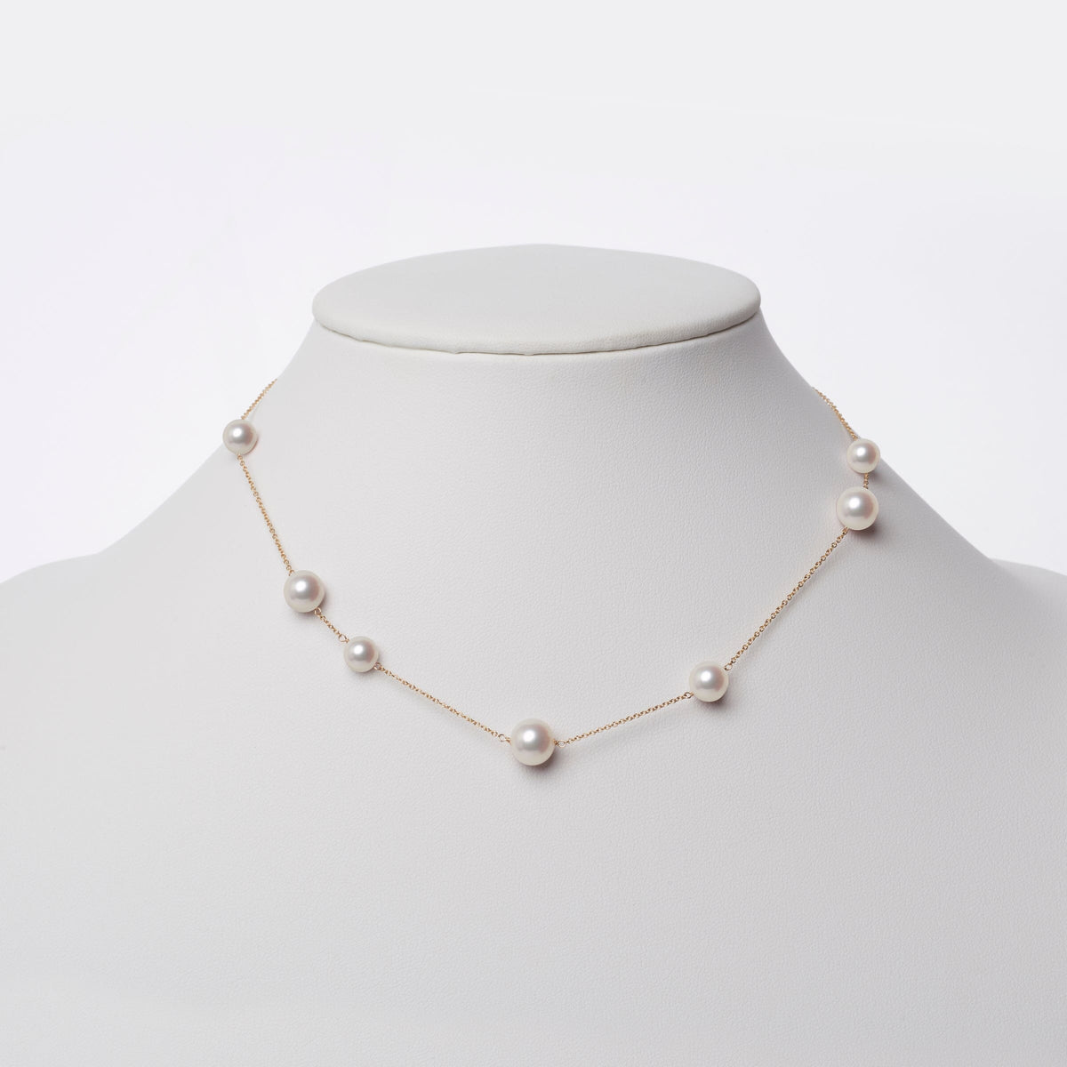 Luna Collection White Freshadama Pearl Necklace featuring a delicate gold chain with evenly spaced lustrous white freshwater pearls for an elegant, minimalist look.