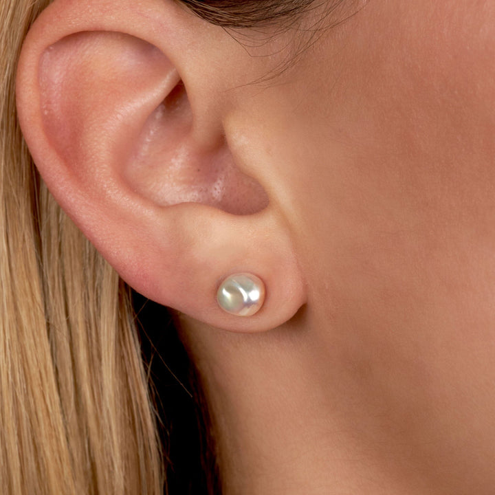 6.0-7.0 mm Keshi Pink to Peach Freshwater Pearl Stud Earrings on model
