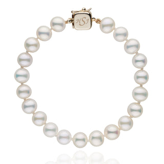 Personalized 7.5-8.0 mm AAA White Freshwater Pearl Square Clasp Bracelet featuring lustrous white pearls with a gold square clasp engraved for customization.