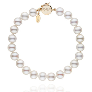 Personalized 7.5-8.0 mm White Freshadama Freshwater Pearl Circle Clasp Bracelet featuring lustrous white freshwater pearls with a polished gold circle clasp and a custom engraved charm.
