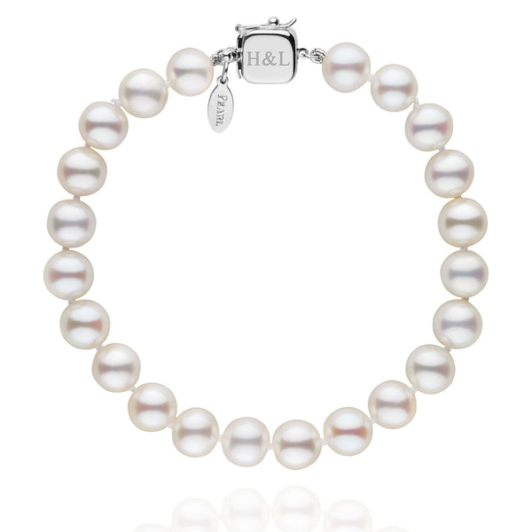 Personalized 7.5-8.0 mm White Freshadama Freshwater Pearl Square Clasp Bracelet featuring round white freshwater pearls and a personalized square 14K white gold clasp with engraving.
