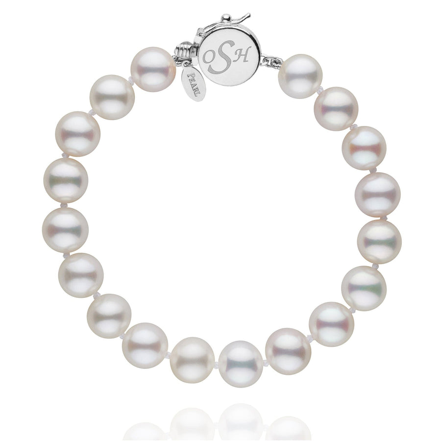 Personalized 8.5-9.0 mm White Freshadama Freshwater Pearl Circle Clasp Bracelet featuring lustrous white pearls with a polished 14K white gold circle clasp engraved with initials.