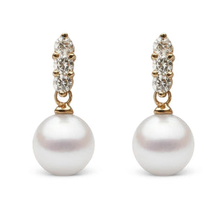 Trio Collection 8.0-8.5 mm Akoya Pearl and Diamond Earrings featuring white akoya pearls suspended from gold settings accented with sparkling round diamonds.