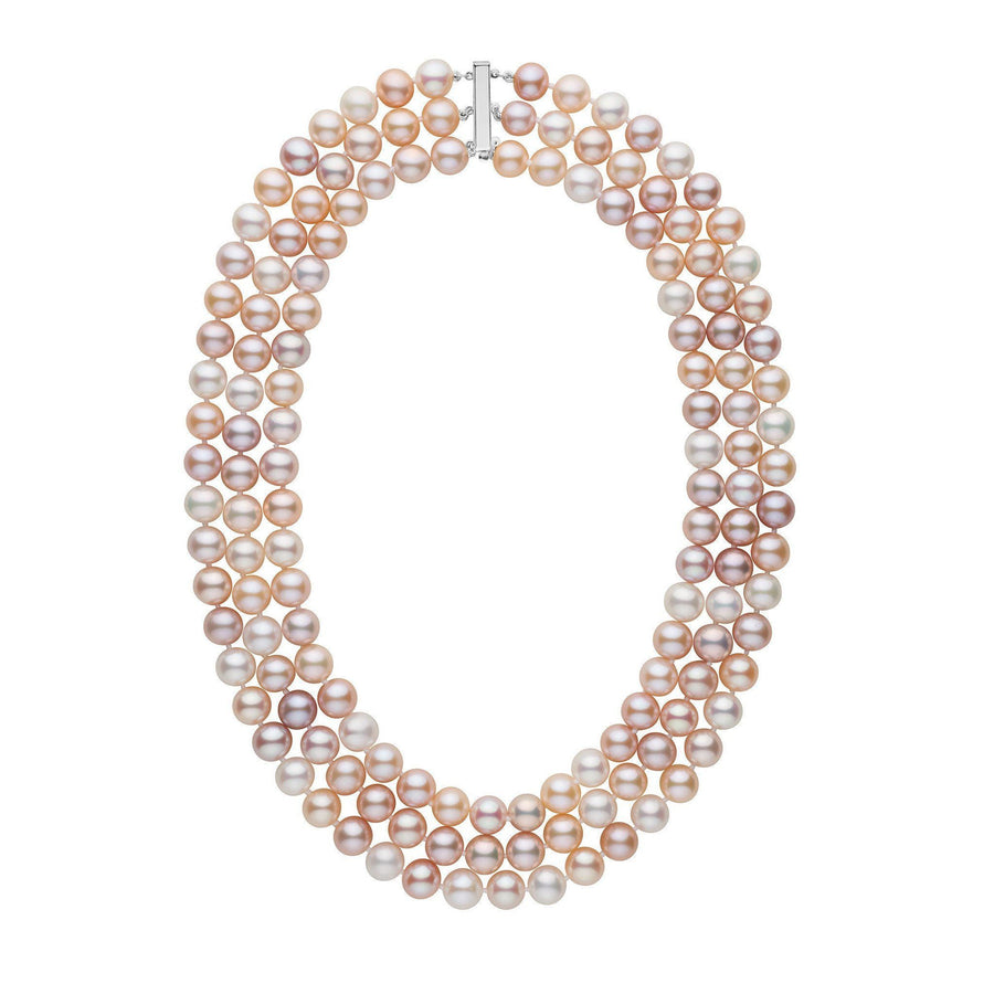 A triple strand multicolor freshwater pearl necklace knotted on silk thread with a gold clasp, displayed against a white background.